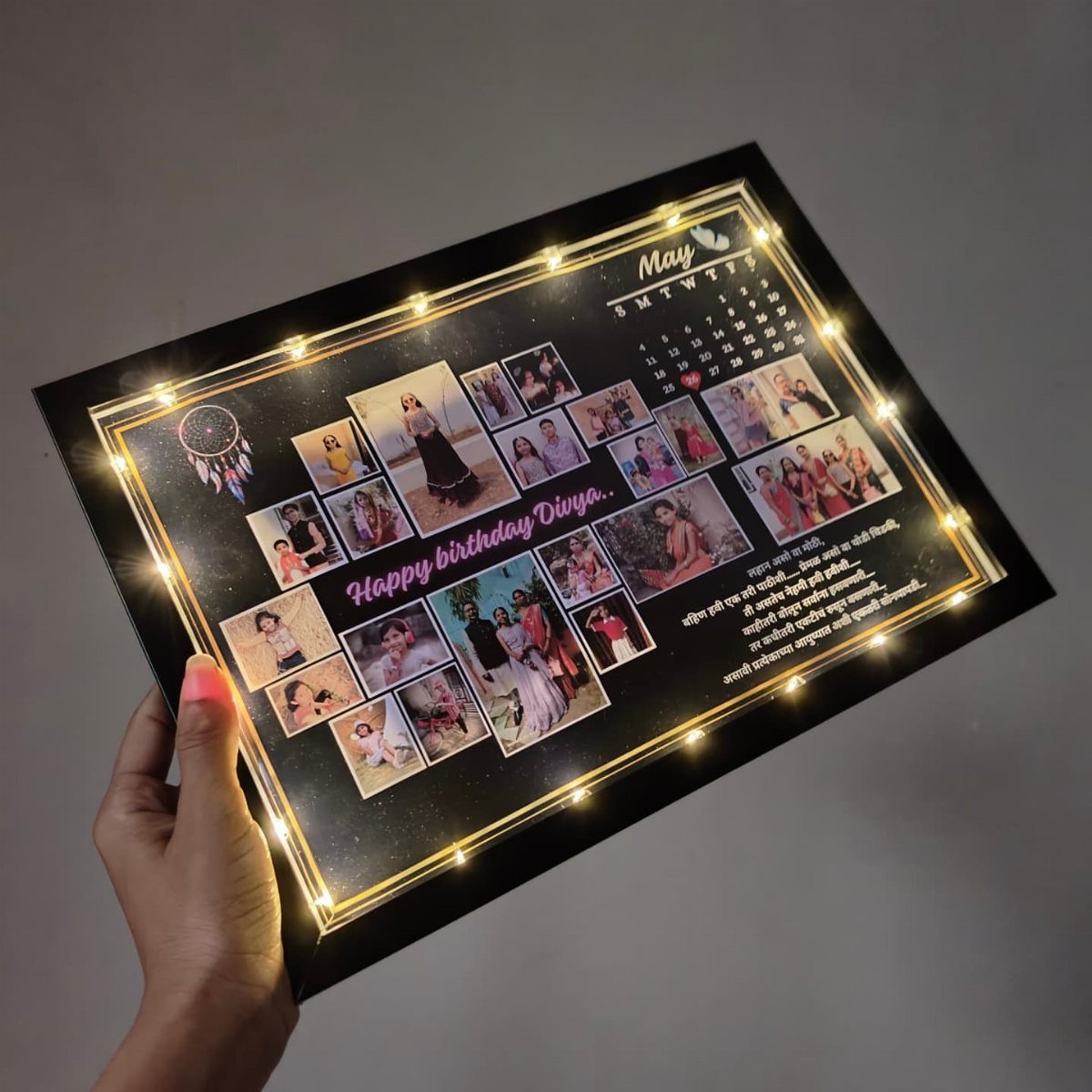 Illuminated black photo frame with a birthday collage and a May calendar.