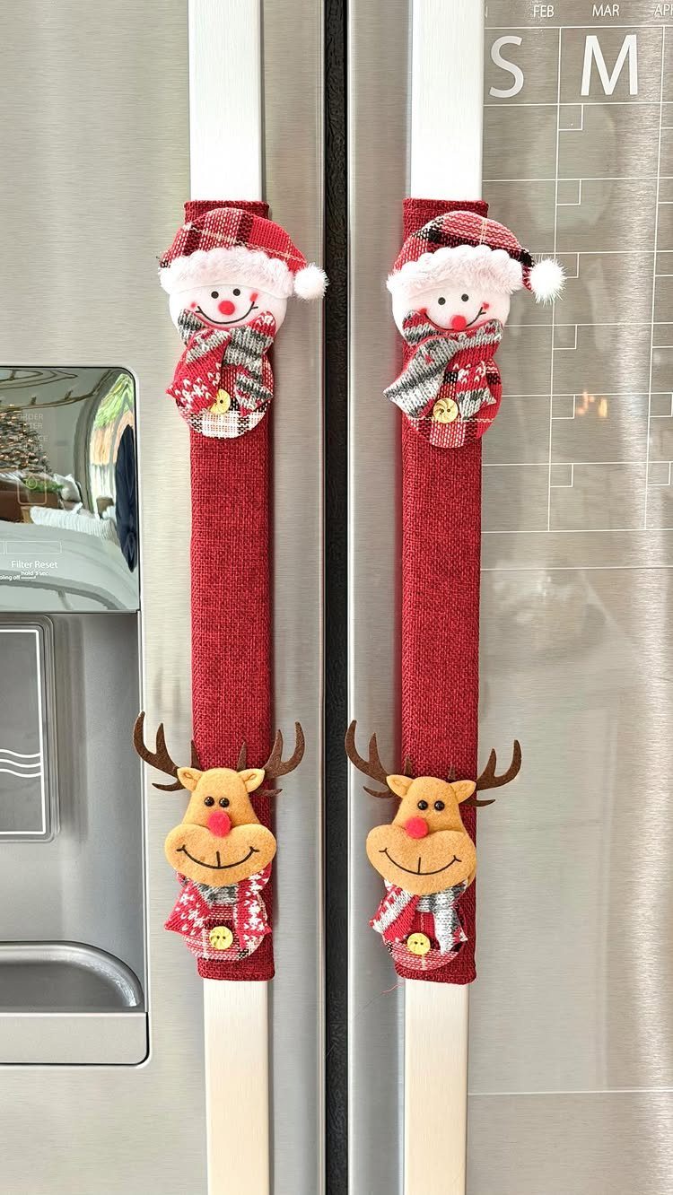 Red fabric refrigerator handle covers featuring plush snowmen and reindeer characters.