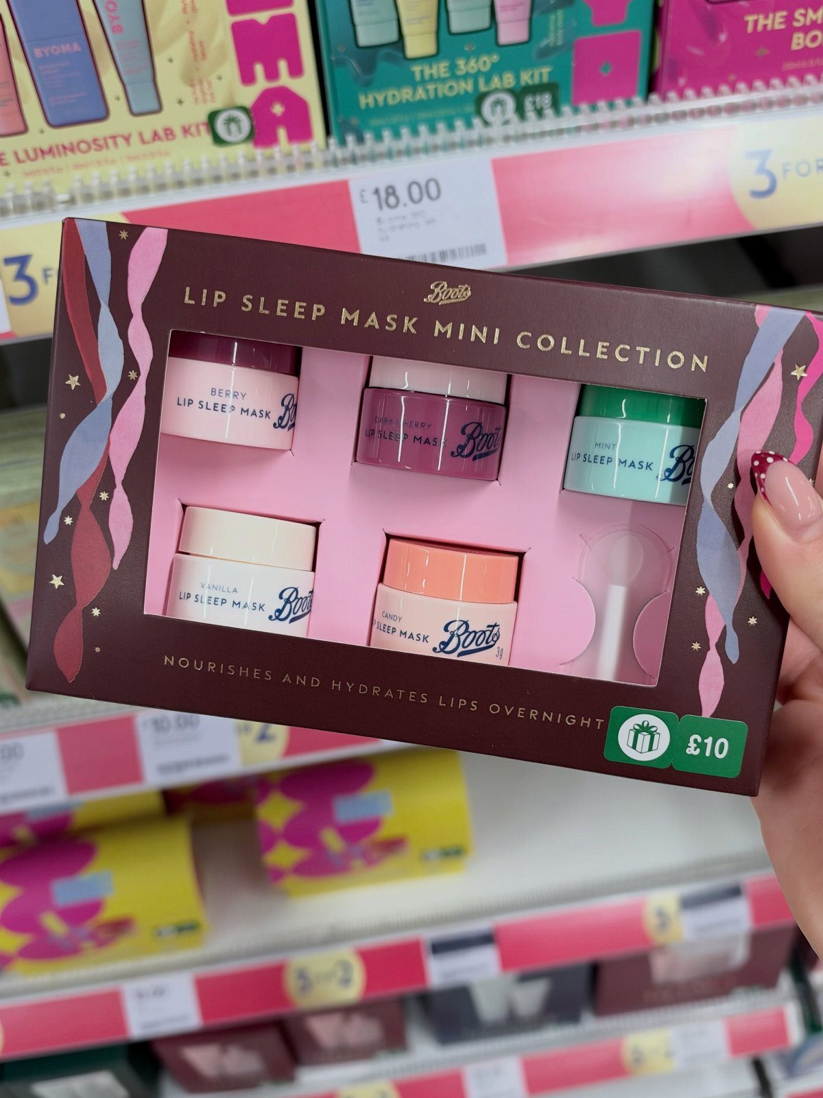 Boots Lip Sleep Mask Mini Collection gift set held in a retail store
