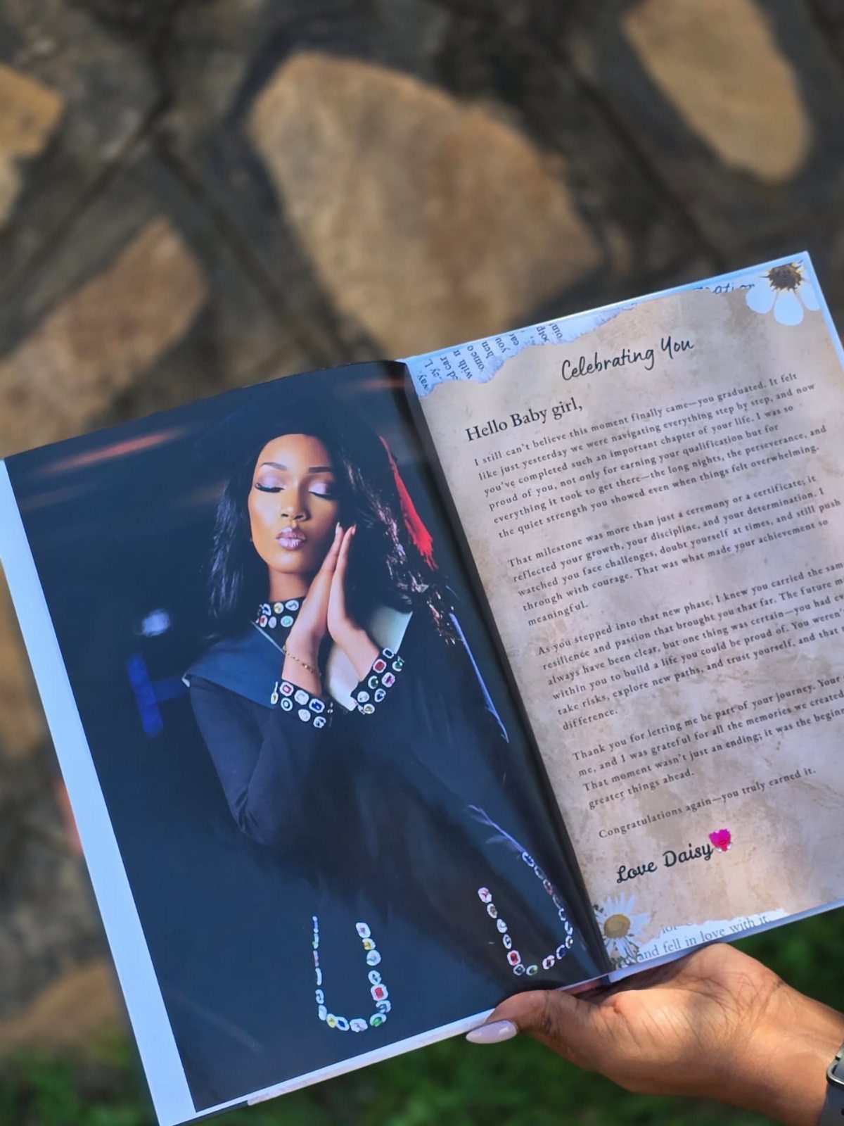 Open personalized photo book featuring a woman's portrait and a heartfelt letter.