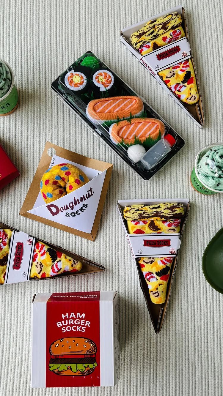 Novelty socks folded to look like sushi, pizza, a doughnut, and a hamburger.