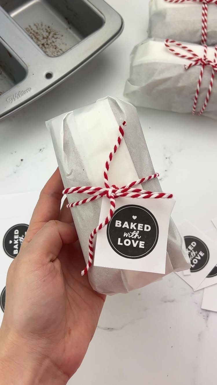Wrapped homemade baked treat tied with red and white twine and a love tag.