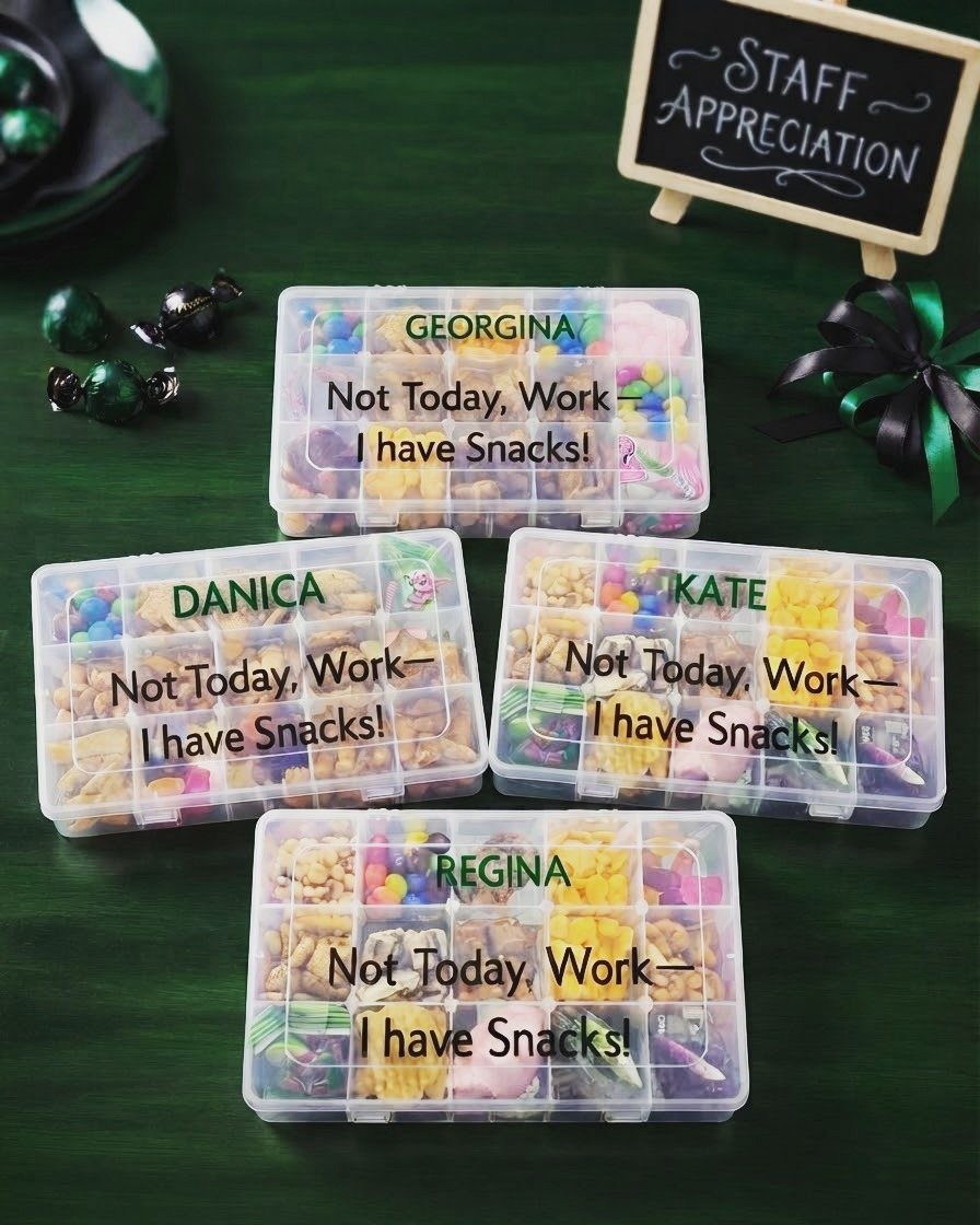Four personalized snack gift boxes filled with colorful treats on a green background.
