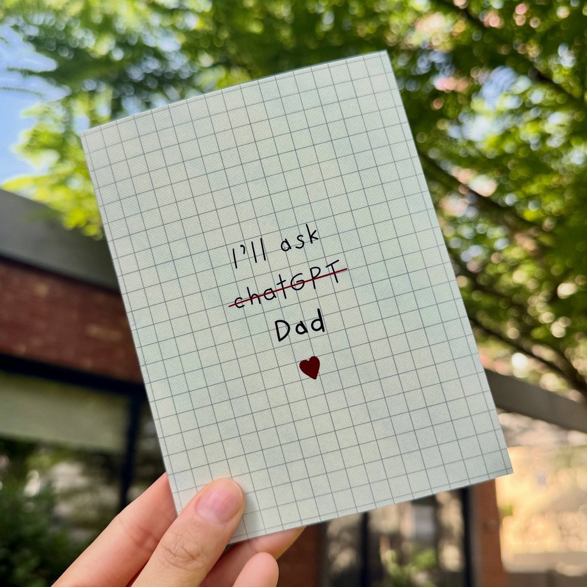 Handwritten note on grid paper for Dad with a small red heart.