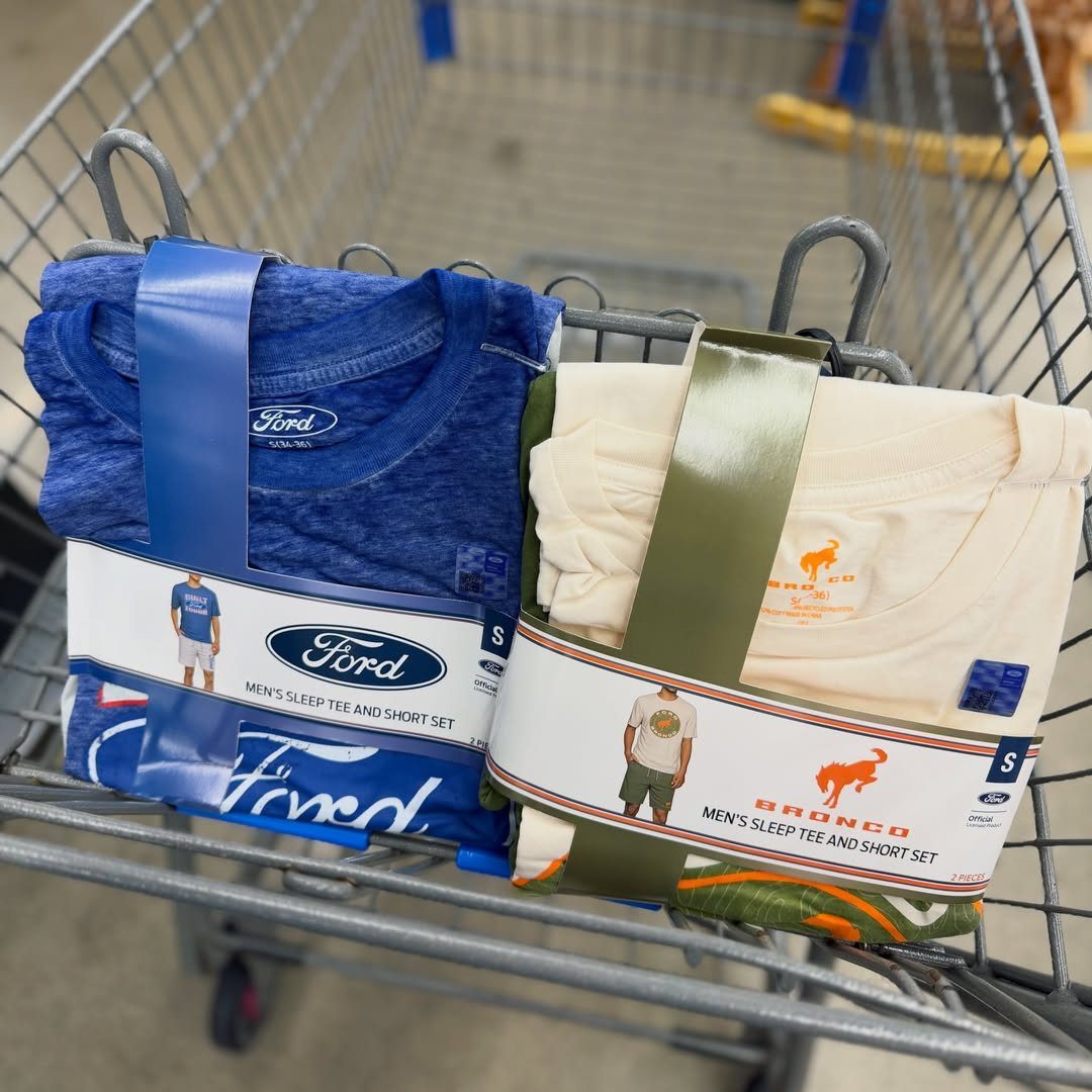 Two packaged men's sleepwear sets in a metal shopping cart.