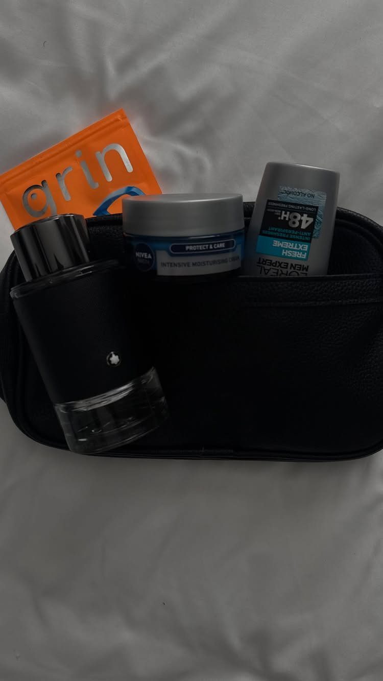 Toiletry bag with cologne, cream, and deodorant as a gift set for men