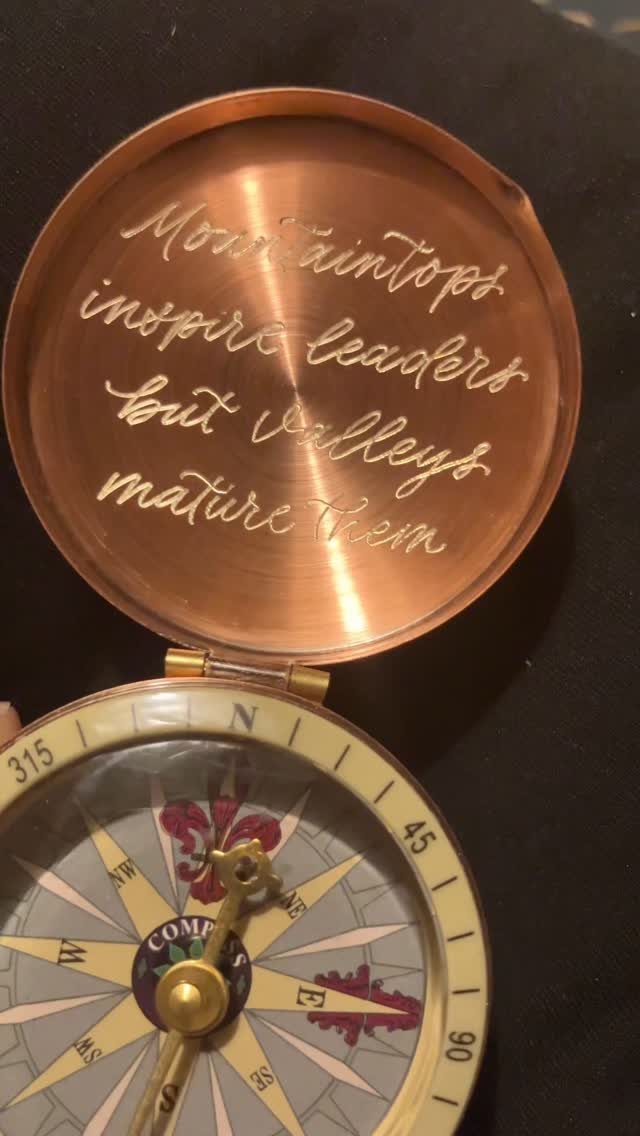 Copper compass with an engraved inspirational quote on the inside of the lid.