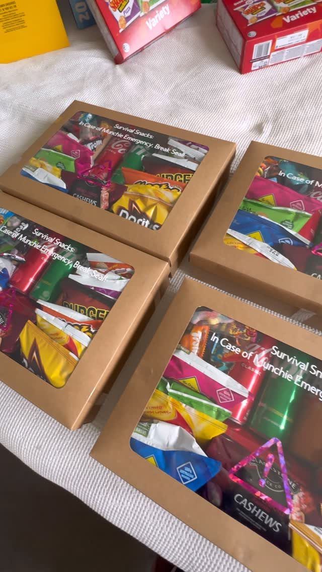 Brown cardboard snack crates filled with colorful packaged treats and survival snack text.