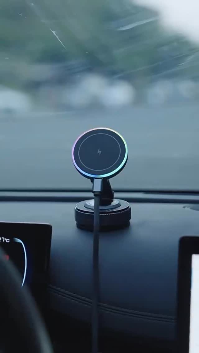 Circular wireless charger with RGB lighting mounted on a car dashboard.