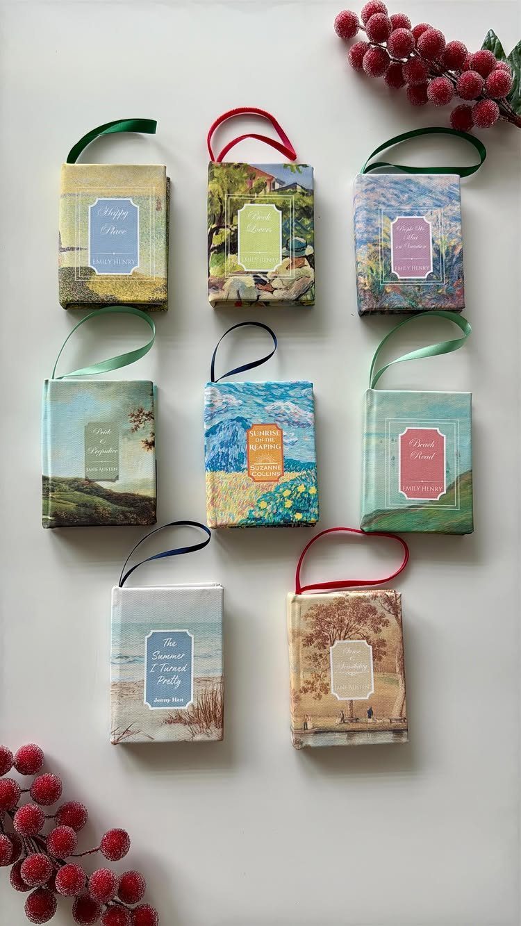 Handmade art-themed gift boxes with ribbon handles and colorful labels on white background