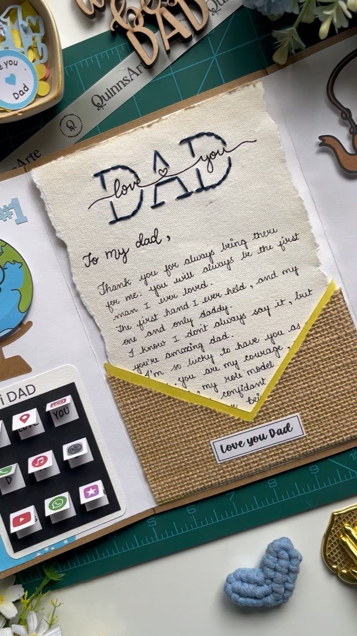 Handmade scrapbook page with a handwritten letter to dad and a burlap pocket.