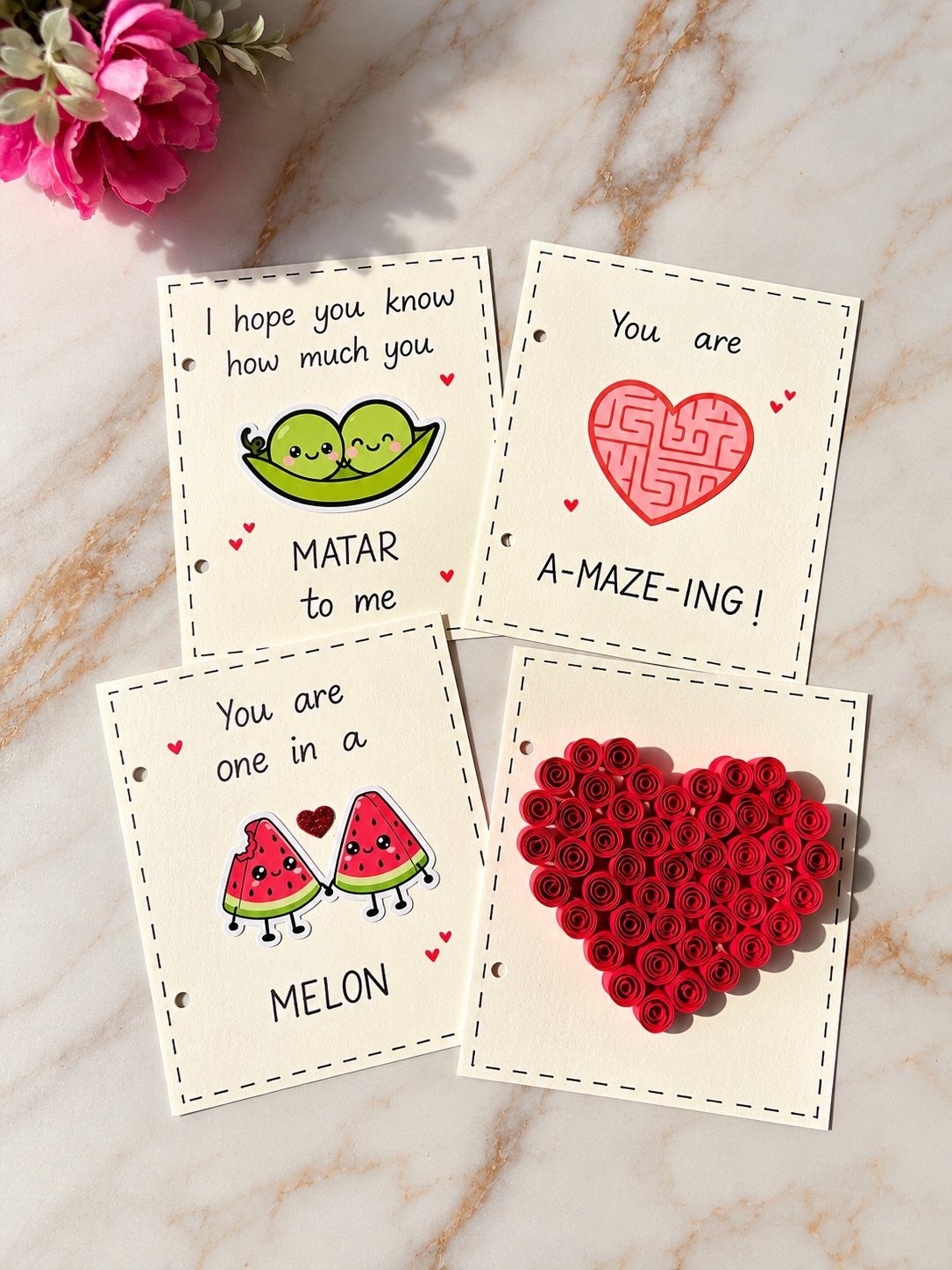 Four handmade pun cards with colorful drawings and a paper rose heart.