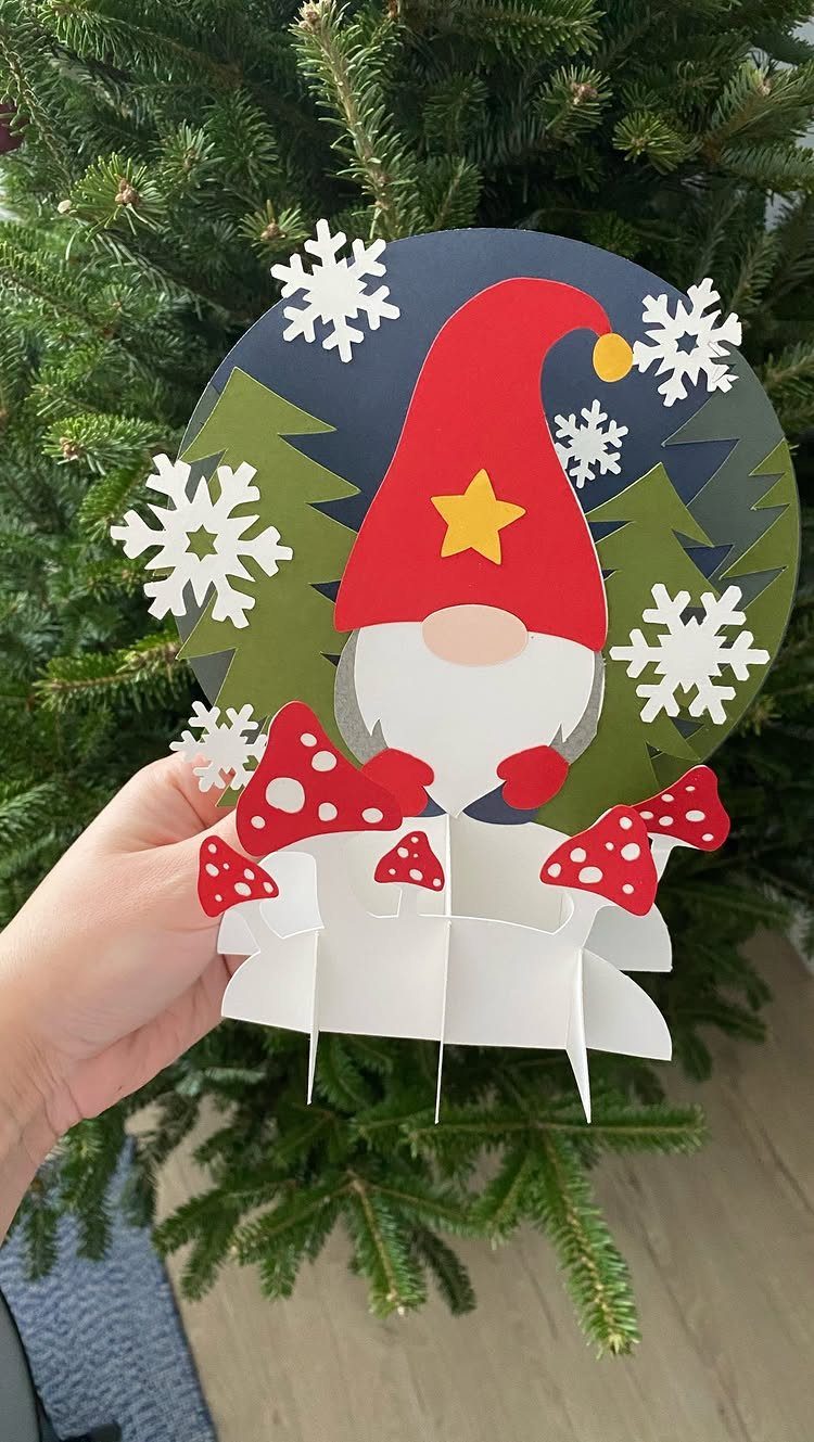 Pop-up Christmas card featuring a cute gnome with red hat and white snowflakes.
