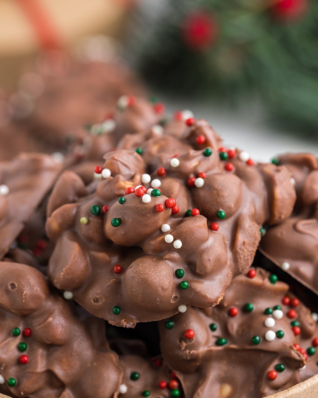 Chocolate clusters with red, green, and white sprinkles for a Christmas treat.