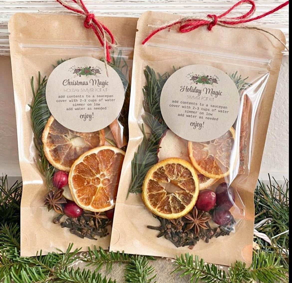 Two kraft paper gift bags filled with dried citrus and spices for stovetop potpourri.