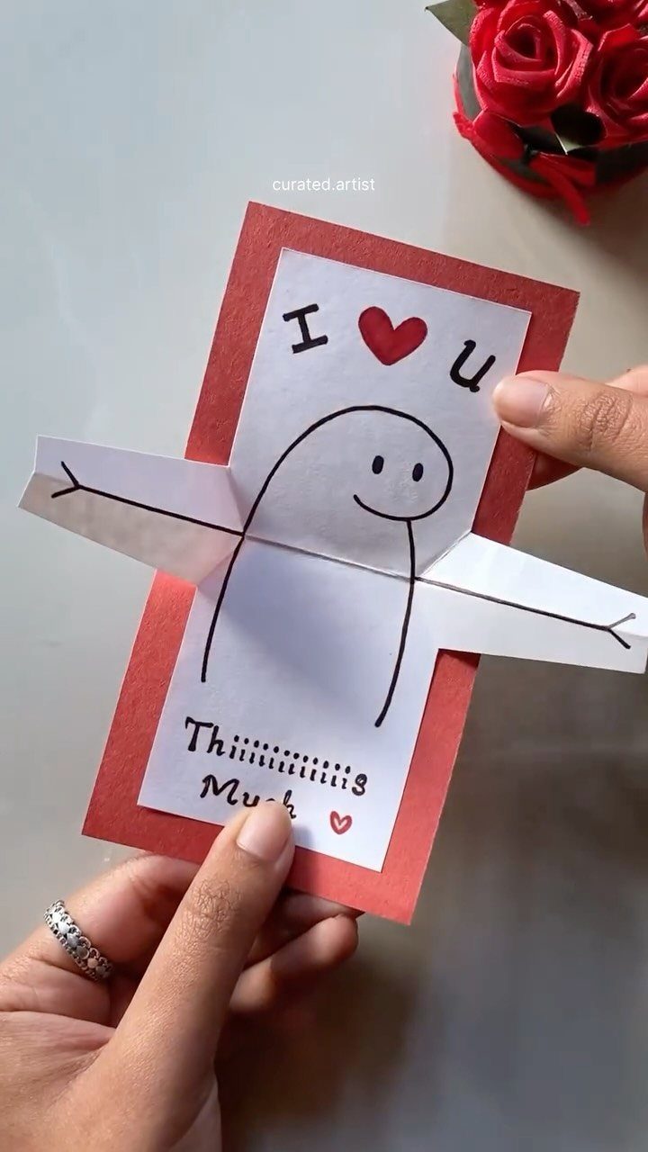 Handmade red and white pop-up card with a cute character and love message.