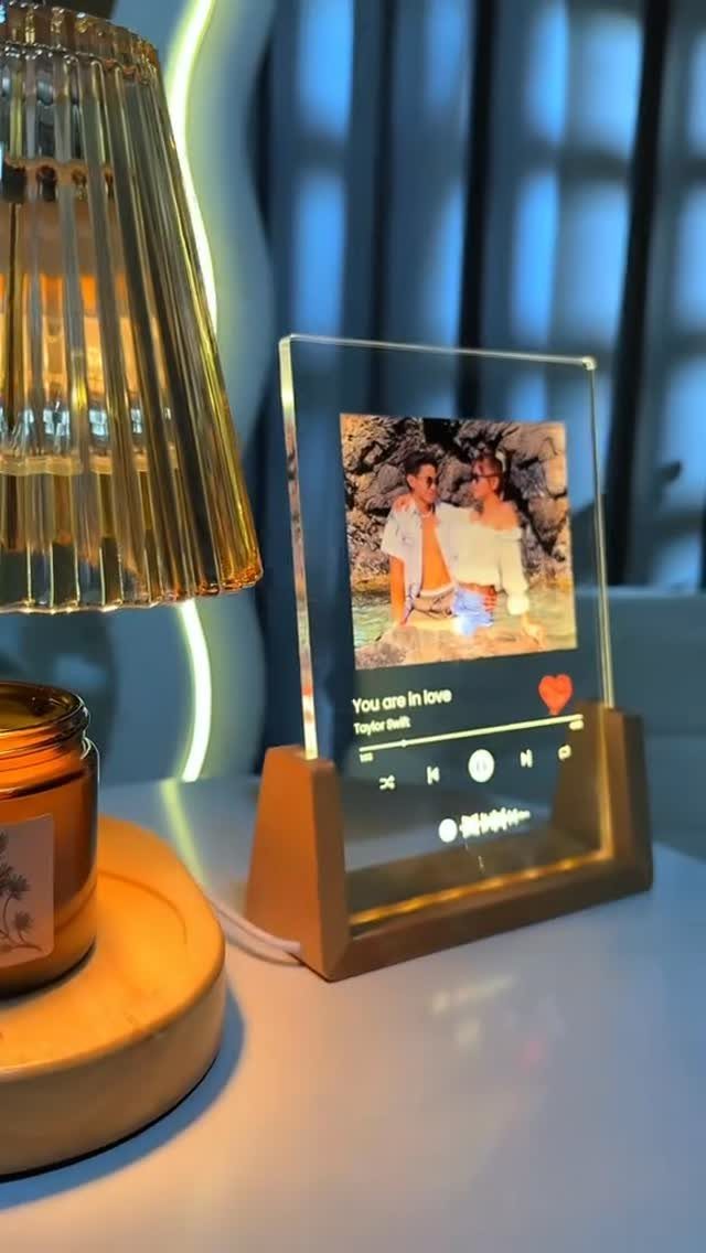 Acrylic photo plaque with a couple's picture and music player design on wooden base