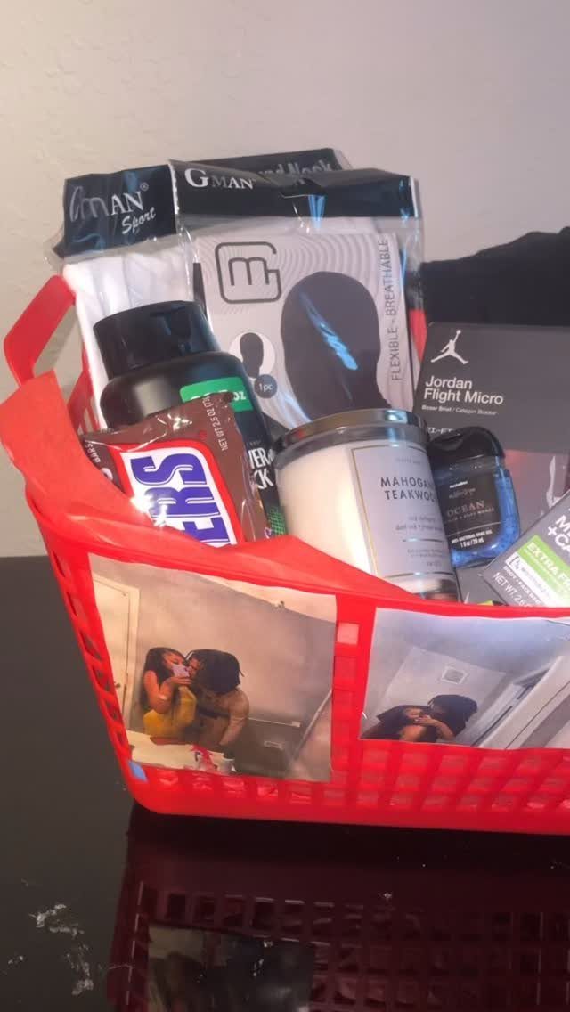 Red plastic gift basket filled with grooming products and photos of a couple.