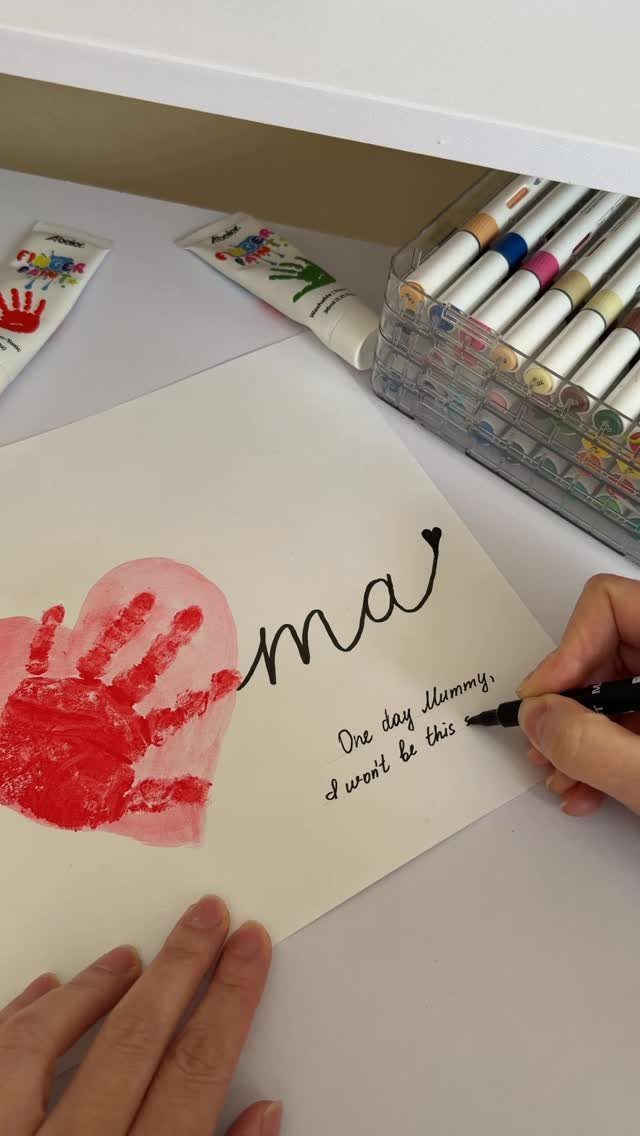 Red child's handprint heart on paper with the word Mama and handwritten text.