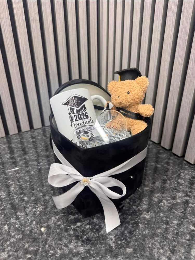 Graduation gift basket with a 2026 graduate mug and a teddy bear.