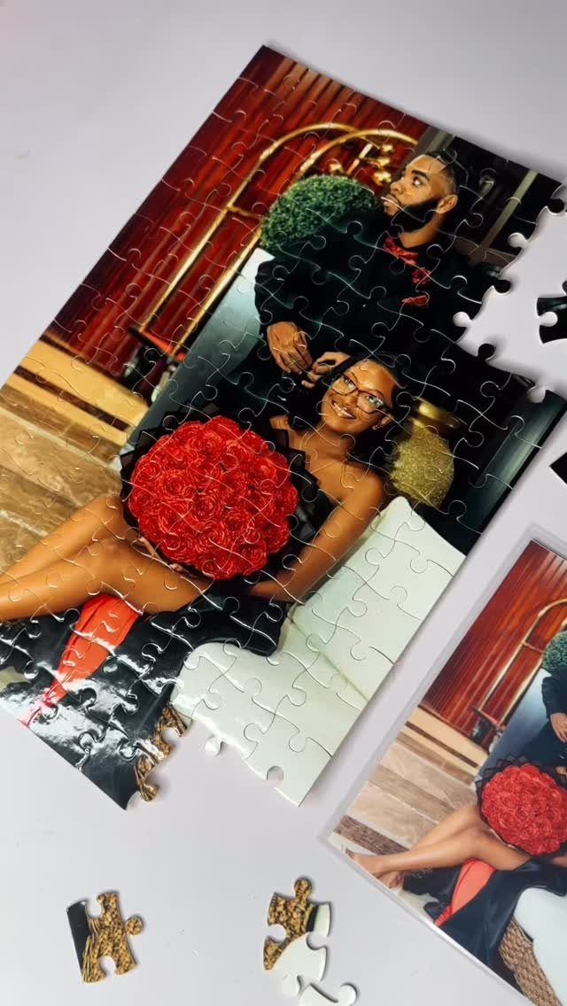 Partially completed custom jigsaw puzzle showing a couple posing with red flowers.
