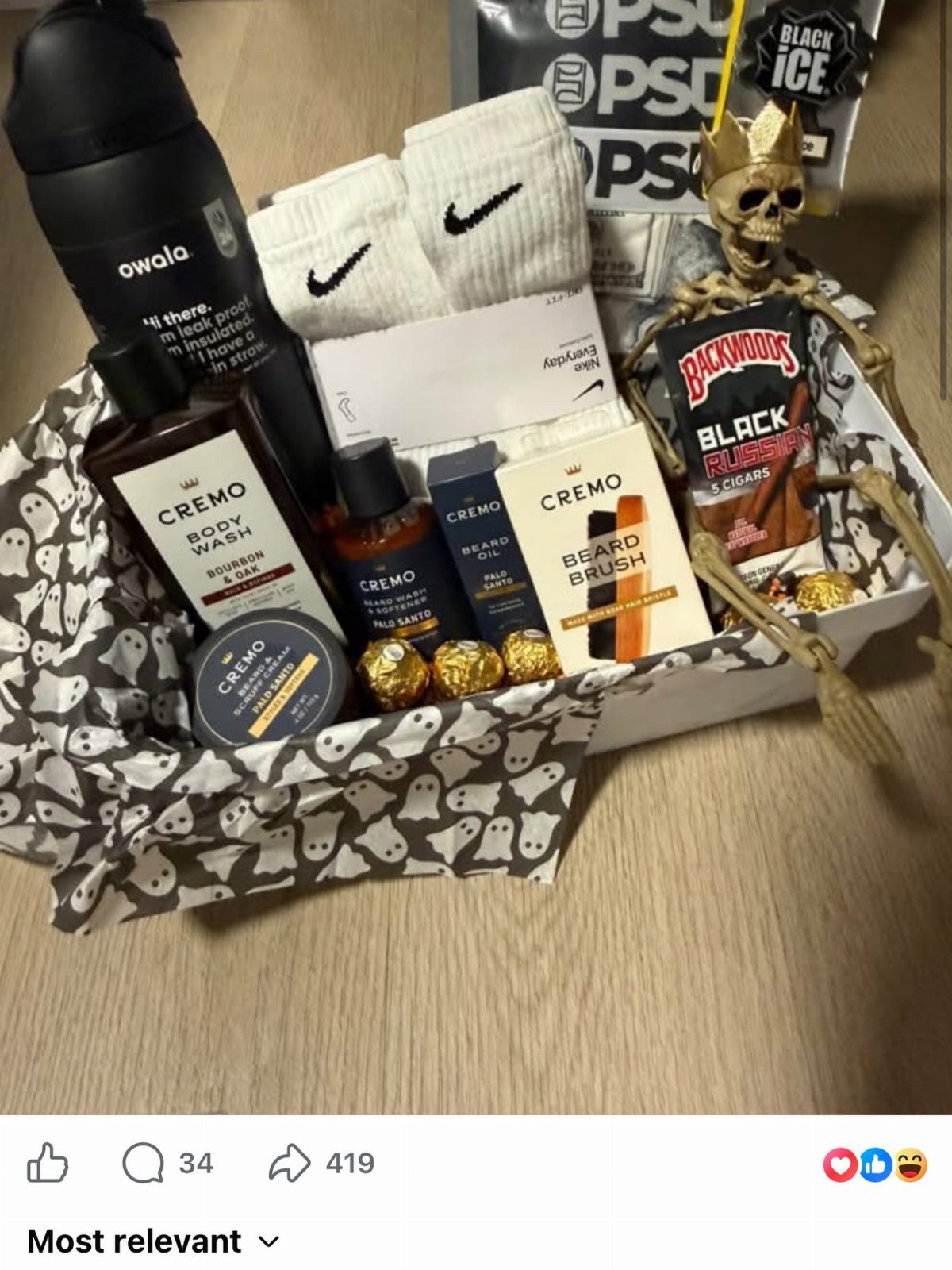 Gift basket with grooming products, Nike socks, water bottle, and a small skeleton.
