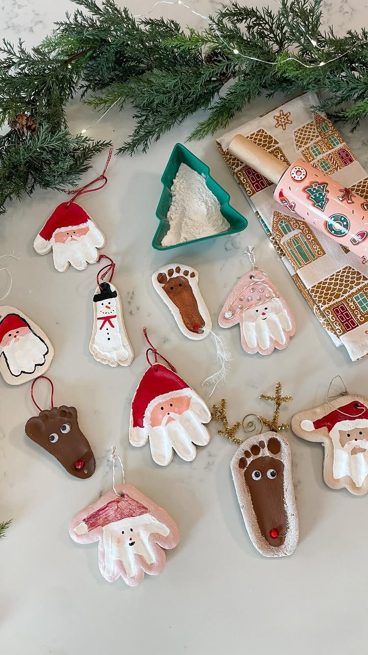 Handmade salt dough handprint and footprint ornaments painted as festive Christmas characters.