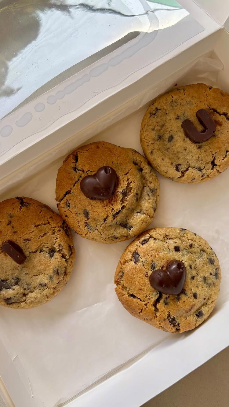 Chocolate chip cookies with chocolate hearts in a white gift box