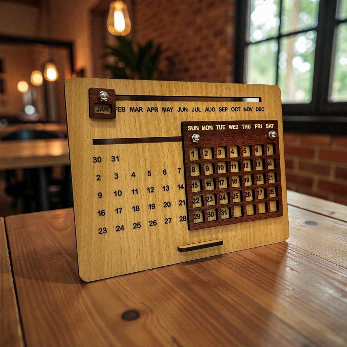 Wooden perpetual desk calendar with sliding markers on a light wood table surface.