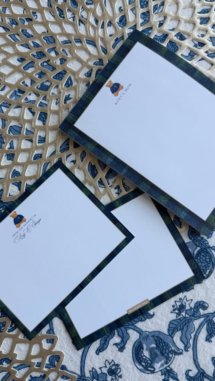 Personalized white stationery with plaid borders and bear illustrations on a decorative background.