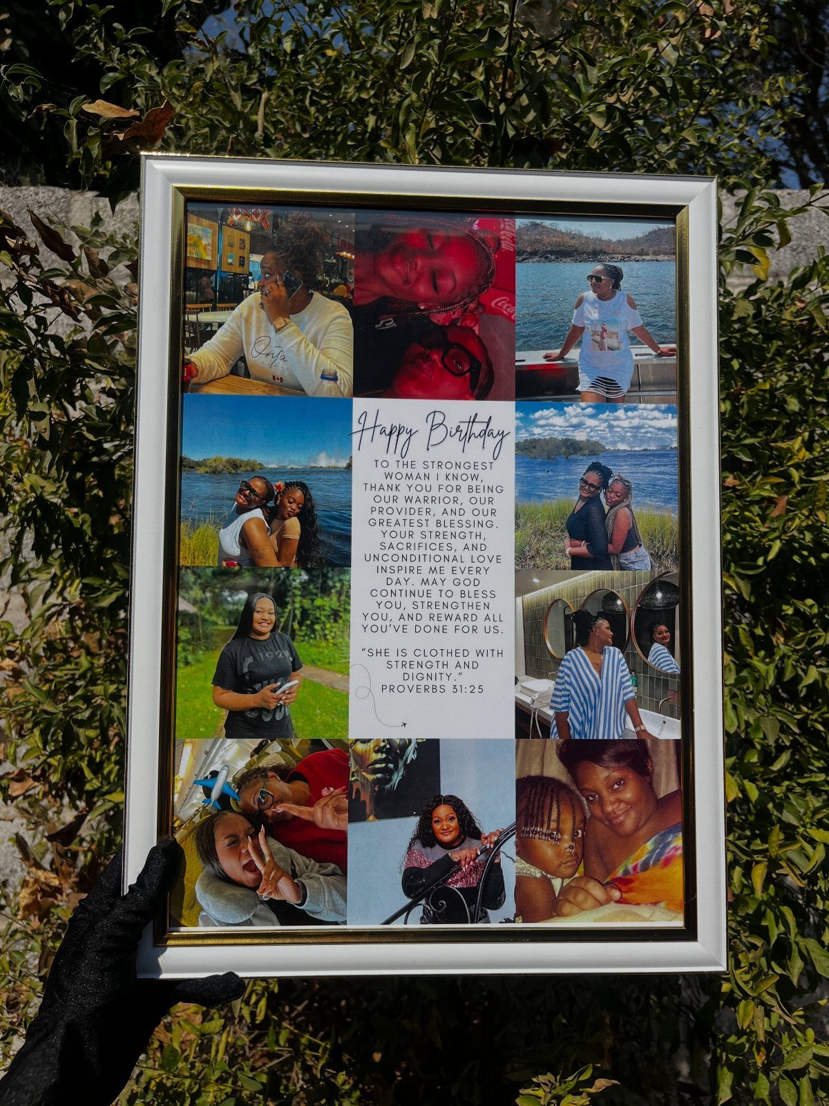 Framed picture collage with family photos and a birthday message held against greenery