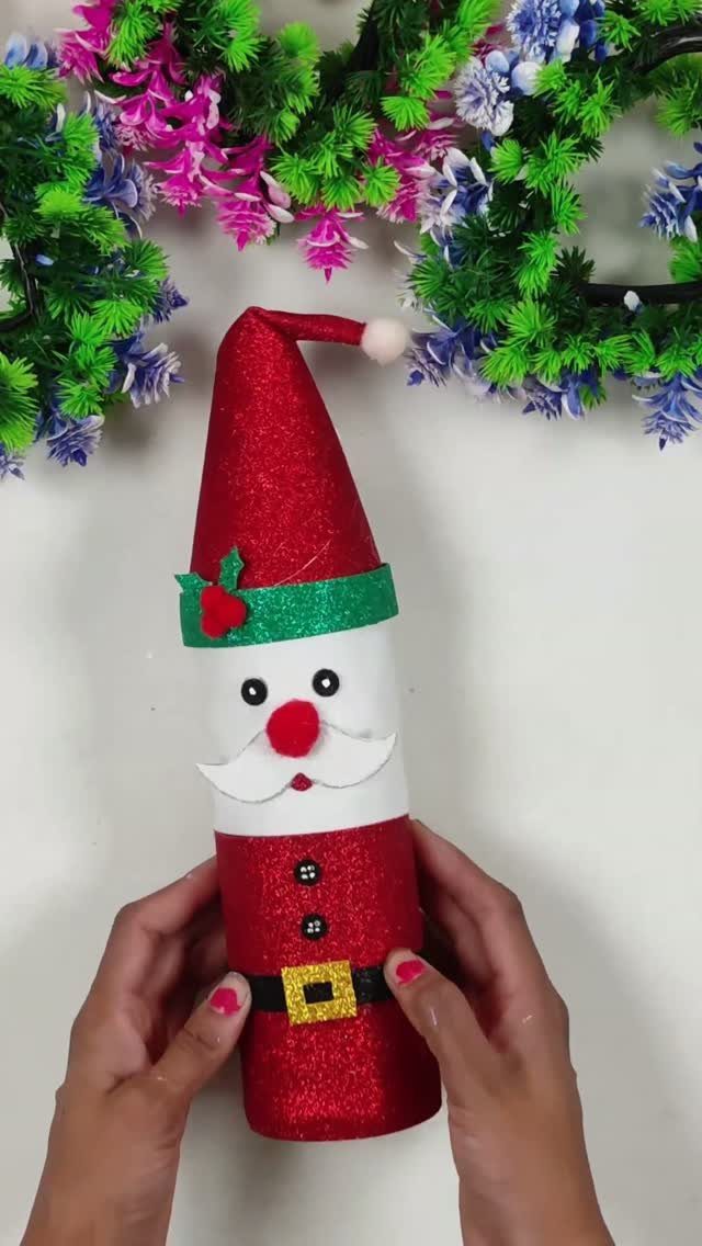 Santa Claus figure made from a coffee can with red glitter and felt details