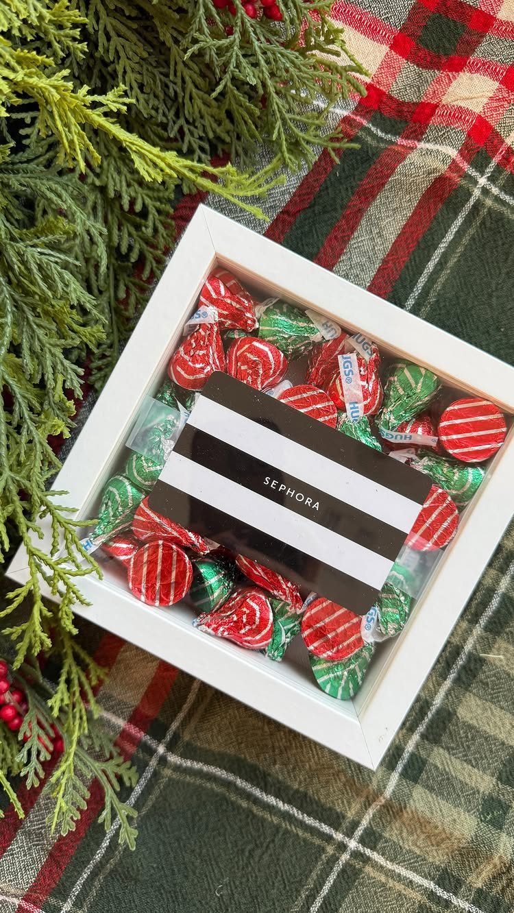 Sephora gift card and peppermint candies in a white frame on plaid fabric