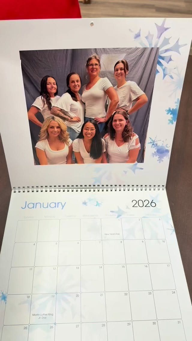 Spiral-bound wall calendar for January 2026 featuring a group photo of six women.